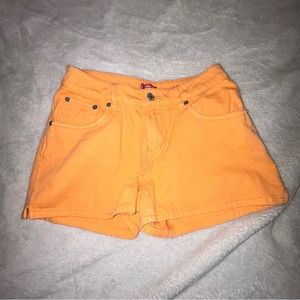 Bright orange jean shorts in size s from “Levi’s “